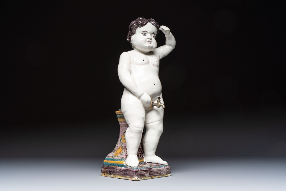 A rare large polychrome Brussels faience 'Manneken Pis' fountain with pewter tap, 18th C.
