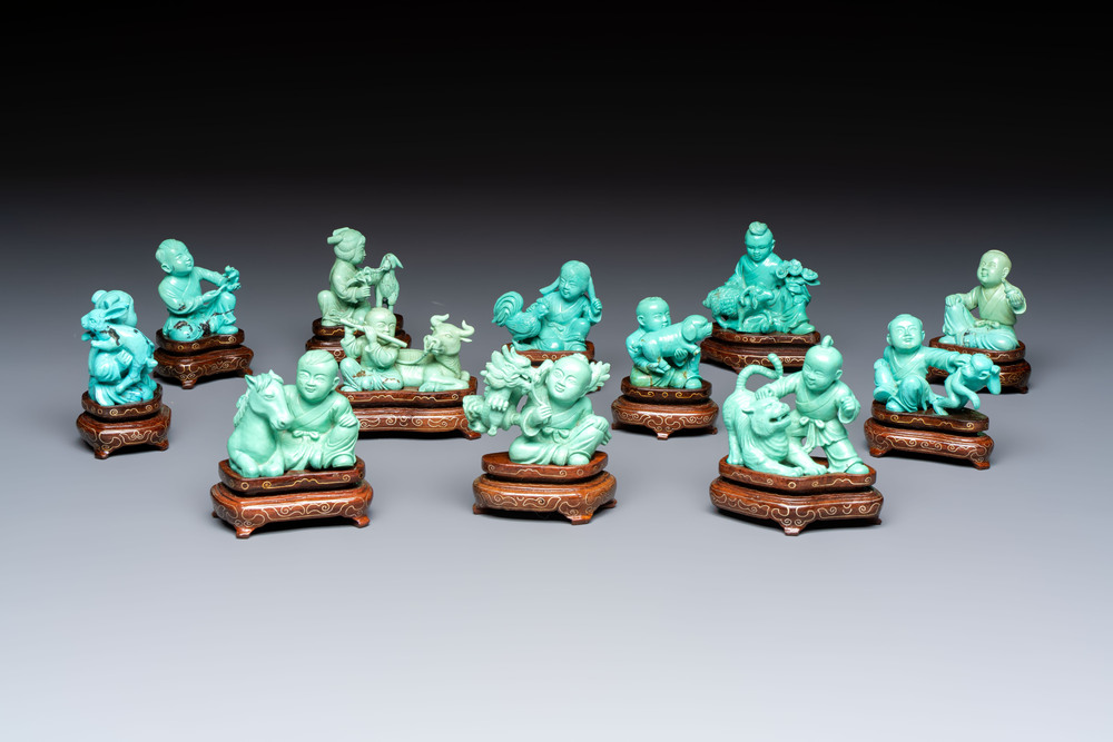 A complete set of 12 Chinese carved turquoise 'Children at Play with the Zodiac Animals' figures on wooden stands, Republic