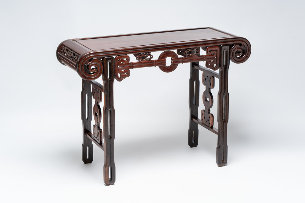 A Chinese elmwood console table, 19th C.