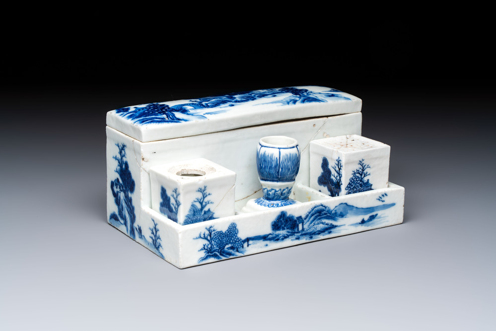 A rare Chinese blue and white 'Mountainous Landscape' writing set with an inkwell, sander and candlestick, Qianlong