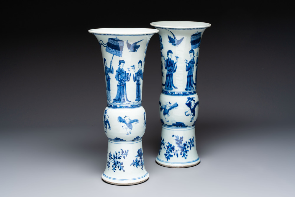 A pair of large Chinese blue and white 'Gu' vases with elegant ladies and playing boys, Kangxi