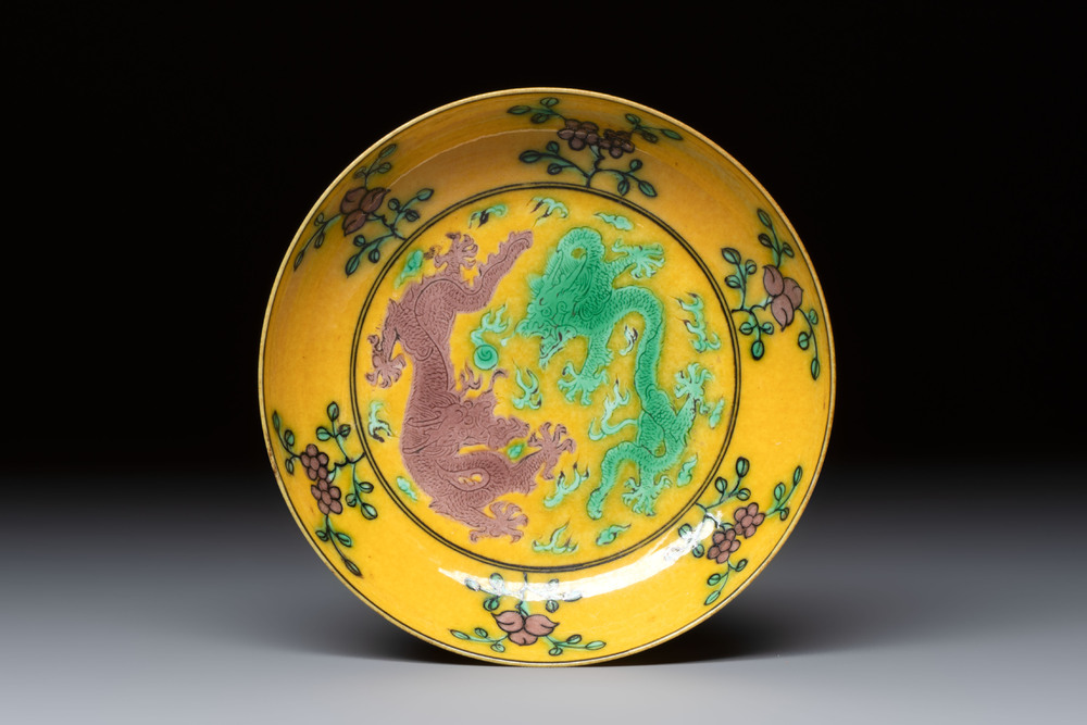 A small Chinese yellow-ground aubergine and green enamelled dragon plate, Qianlong mark, 19/20th C.