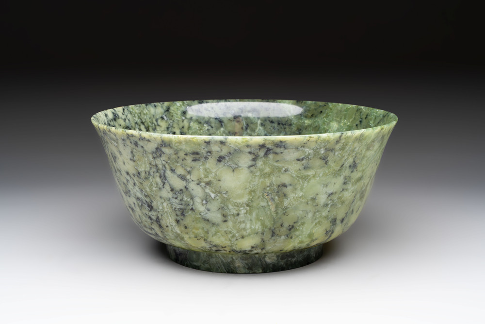 A large Chinese mottled-green serpentine bowl, 20th C.