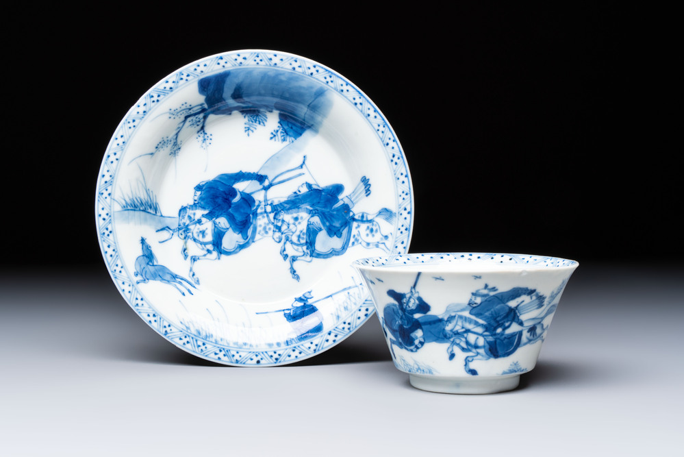 A Chinese blue and white 'Hunting Scene' cup and saucer, Kangxi