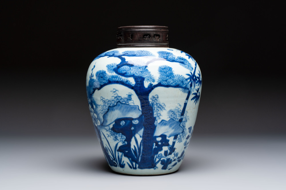 A Chinese blue and white 'Three Friends of Winter' jar with an openworked wooden cover, Transitional period