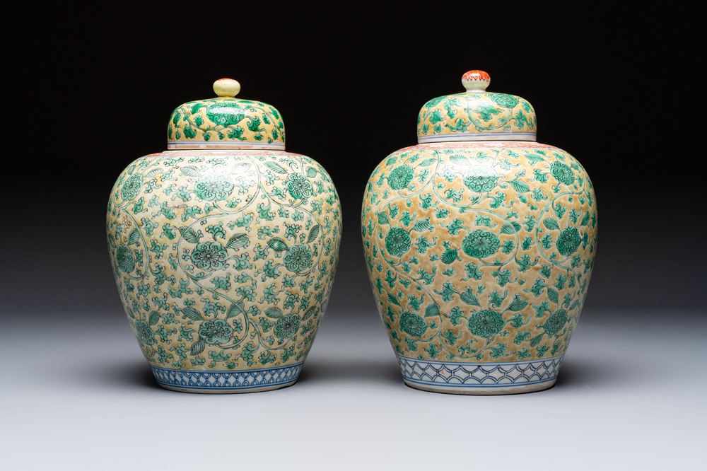 A rare pair of Chinese famille verte yellow-ground 'Flower Scroll' covered vases, Kangxi