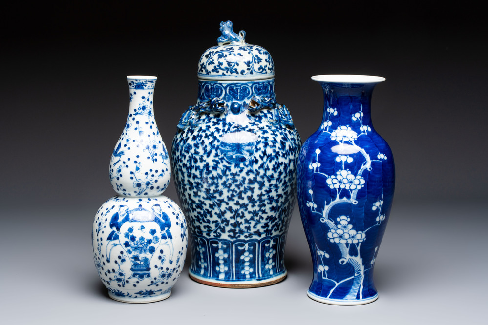 Three Chinese blue and white vases, one covered, Kangxi mark, 19th C. and later