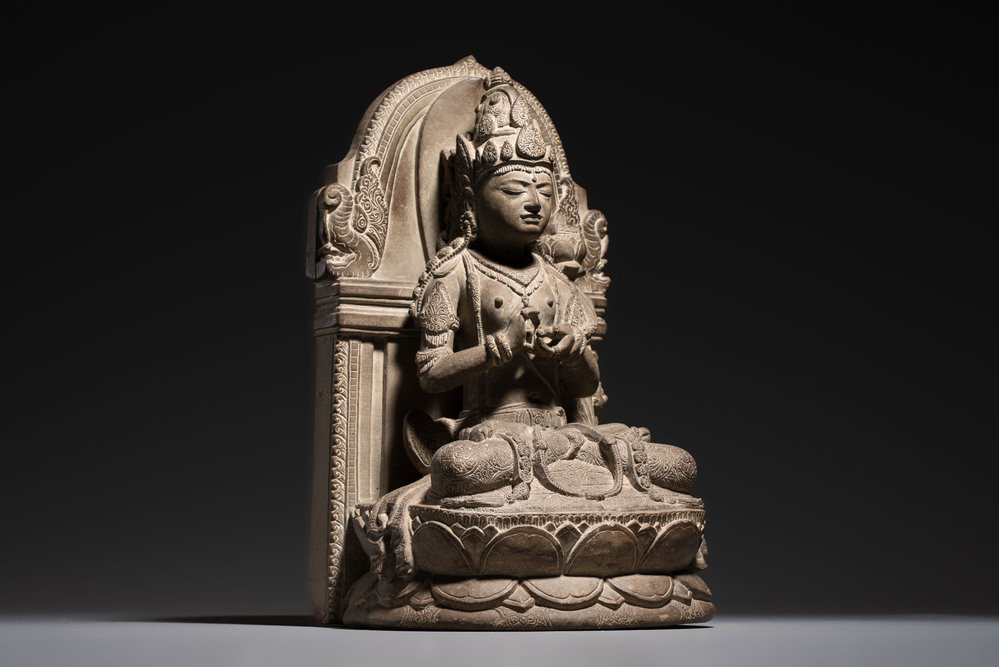 A Javanese carved stone figure of Prajnaparamita, 20th C.