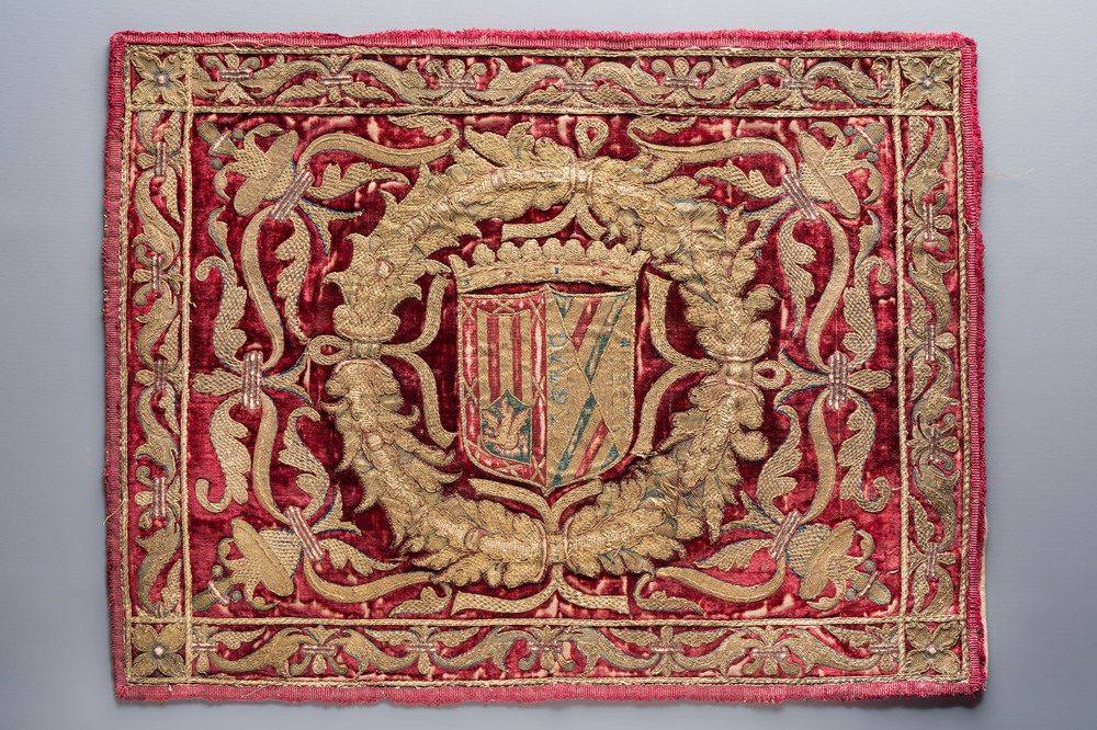 A Spanish crimson velvet and gilt brocade embroidery bearing the impaled arms of de la Cueva and Mendoza, 16/17th C.