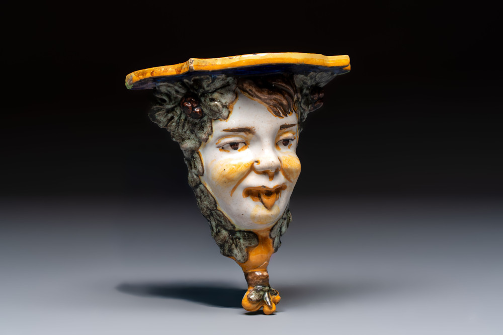 A polychrome Italian maiolica 'Faun Head' wall console, 19th C.