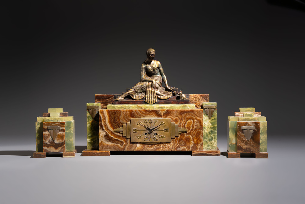 Georges Lavroff (1895&ndash;1991): An Art Deco three-piece copper-alloy-mounted green and brown onyx mantelpiece garniture, ca. 1900