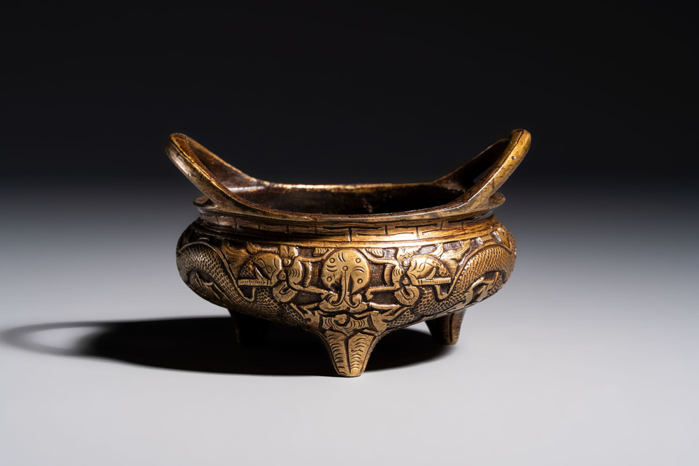 A Chinese bronze tripod 'Dragon' censer with two handles, Xuande mark, 19th C.
