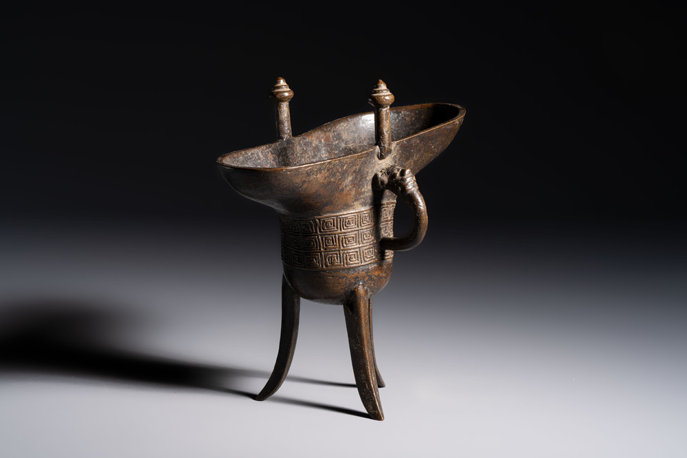 A Chinese archaistic bronze ritual wine vessel, Jue 爵, Qianlong mark, dated 1738