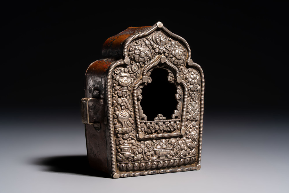 A Tibetan silver and copper Ghau or prayer box, 19th C.