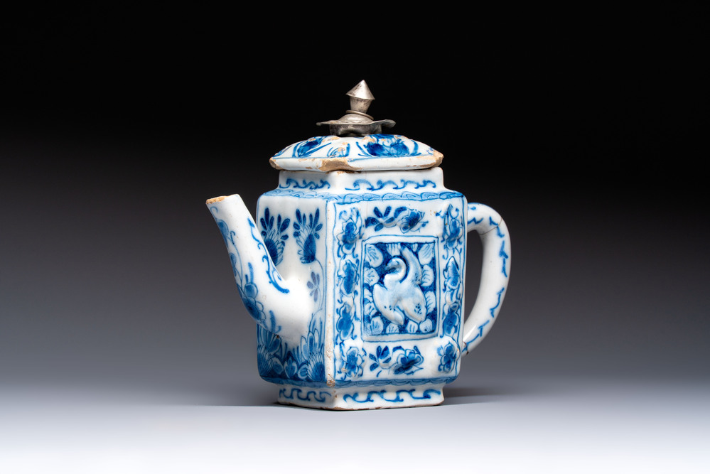 A rare blue and white Dutch Delft relief-moulded teapot and cover, late 17th C.