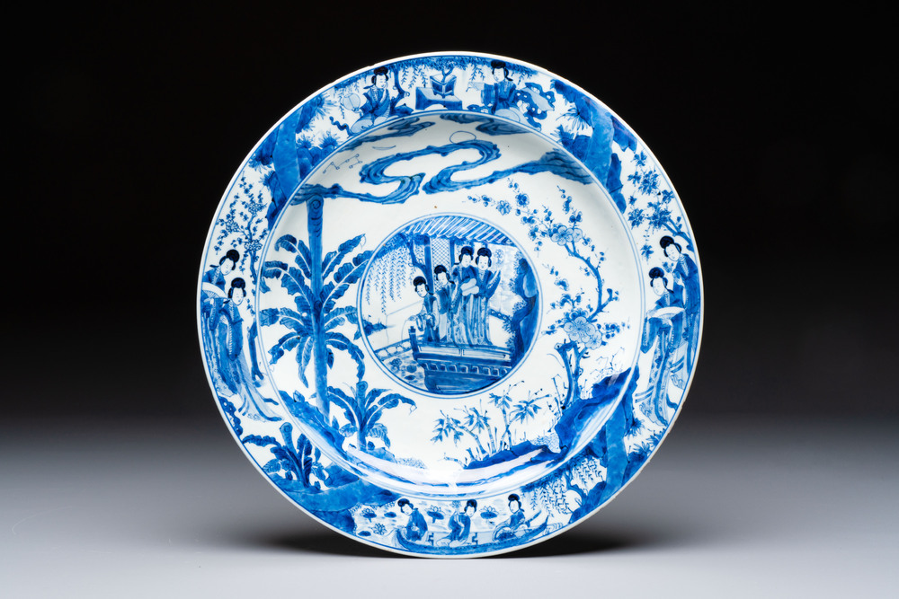 A fine Chinese blue and white 'Elegant Beauties' dish with raised central medallion, Kangxi