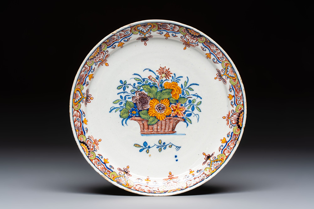 A fine polychrome Dutch Delft 'Flower Basket' plate, 18th C.