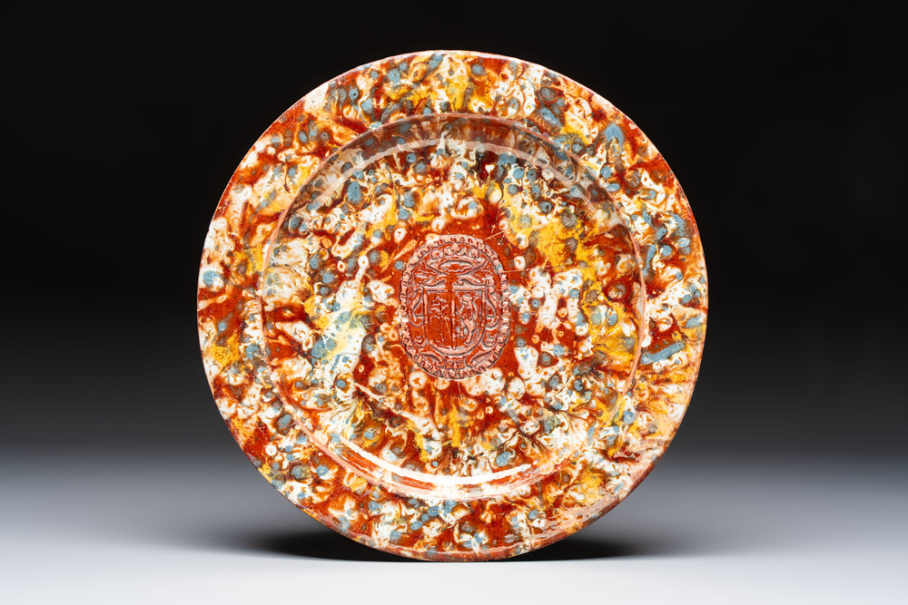 A highly unusual Italian faux marble-splashed armorial pottery dish, 17th C.