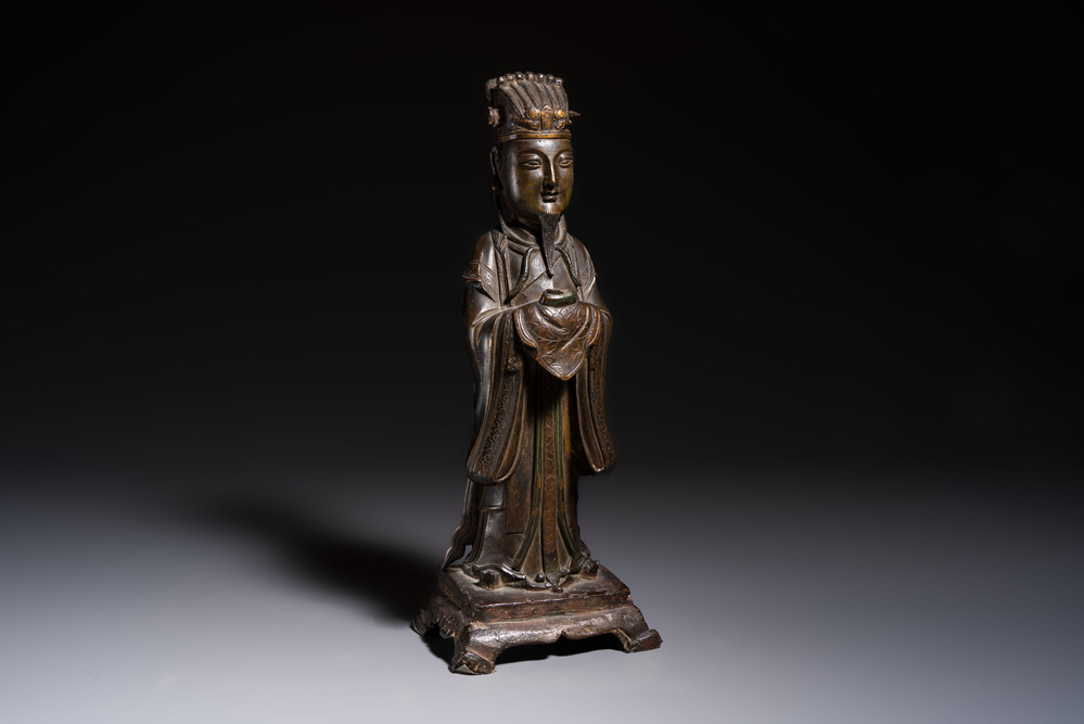 A Chinese bronze figure of an official, Ming