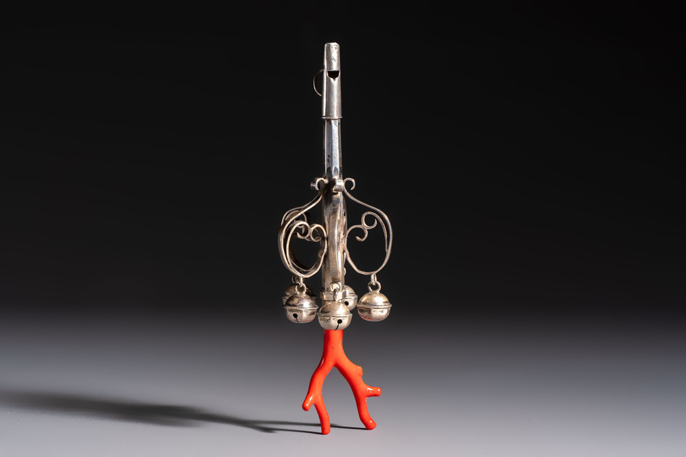 A silver red coral-mounted children's rattle-whistle, 19th C. or earlier