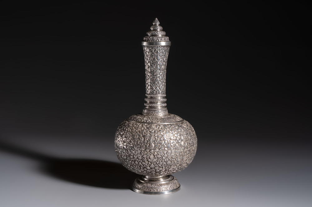 A Thai or Cambodian silver water flask and cover with floral design, late 19/early 20th C.