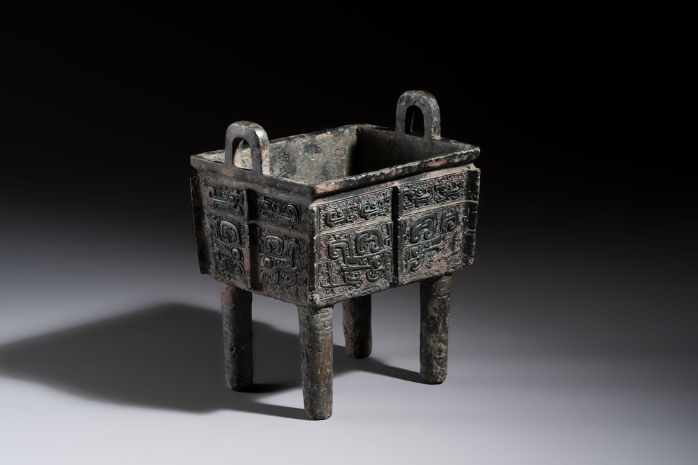 An inscribed Chinese archaic bronze food vessel with Taotie design, Ding 鼎, Western Zhou