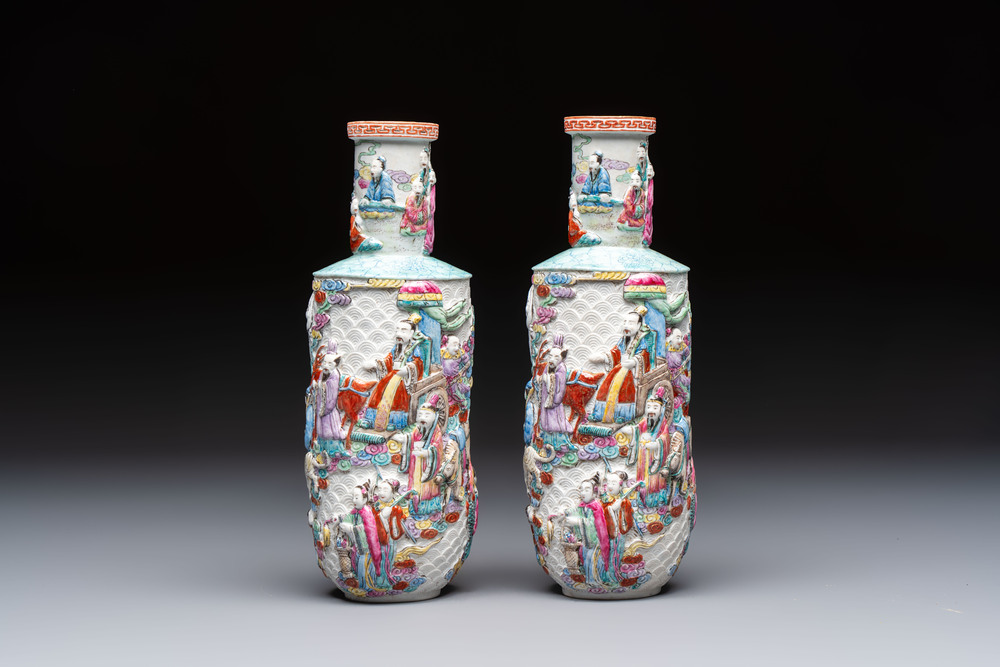 A pair of Chinese famille rose relief-moulded 'Immortals' vases, Qianlong mark, Republic