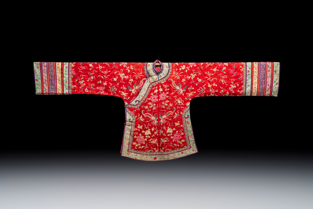 A Chinese embroidered silk red-ground women's robe, 19th C.