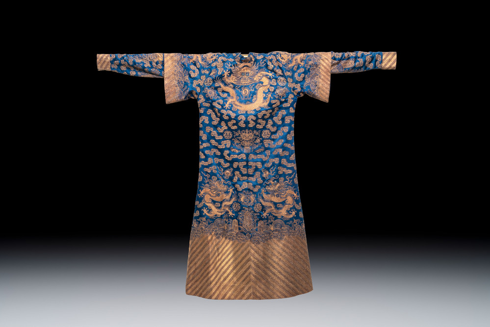 A Chinese embroidered silk blue-ground 'Dragons' robe, adapted into a lady's dress, 19th C. and later