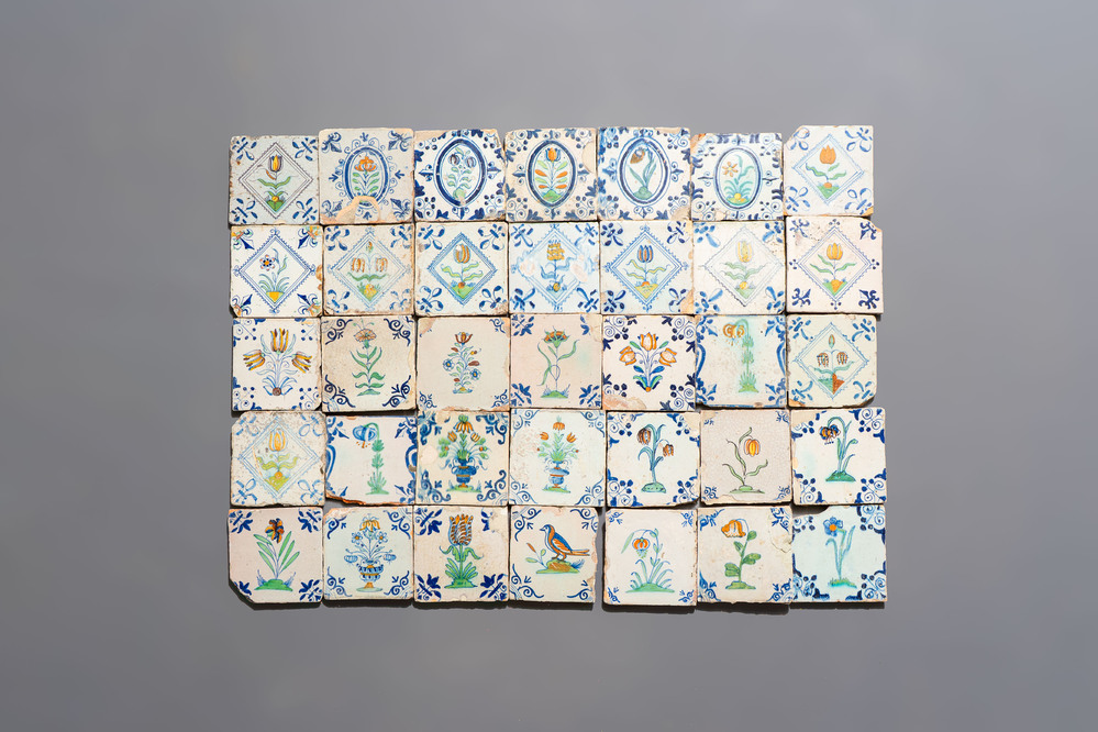 35 polychrome Dutch Delft tiles with varied floral designs, 17th C.