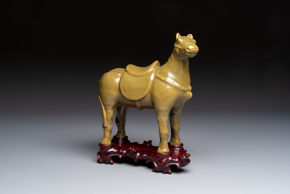A Chinese teadust-glazed model of a horse on a wooden stand, Republic