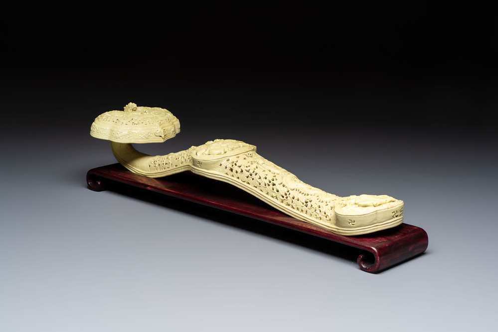 A large Chinese lemon-yellow-glazed biscuit 'Dragons' ruyi in the style of Wang Bingrong, on a wooden stand, Republic