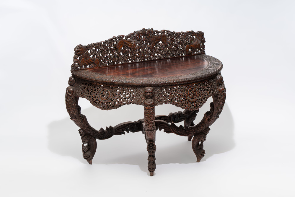 A finely carved Anglo-Indian rosewood demi-lune console table with lions, 19th C.