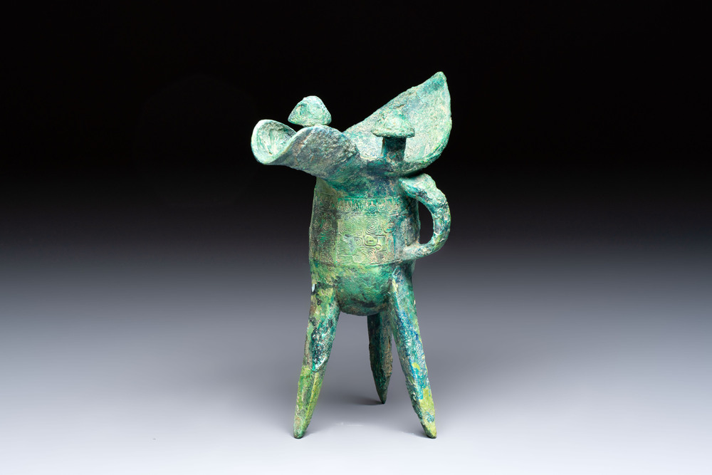 A Chinese archaic bronze wine vessel with Taotie design, Jue 爵, late Shang