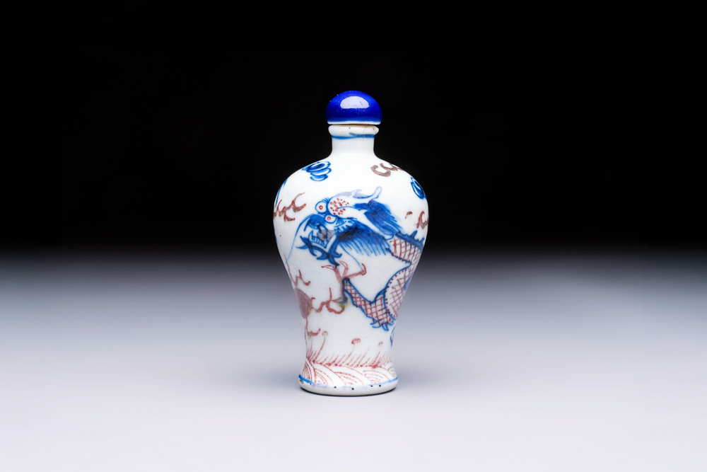 A Chinese blue, white and copper-red 'Dragon' snuff bottle, 19th C.