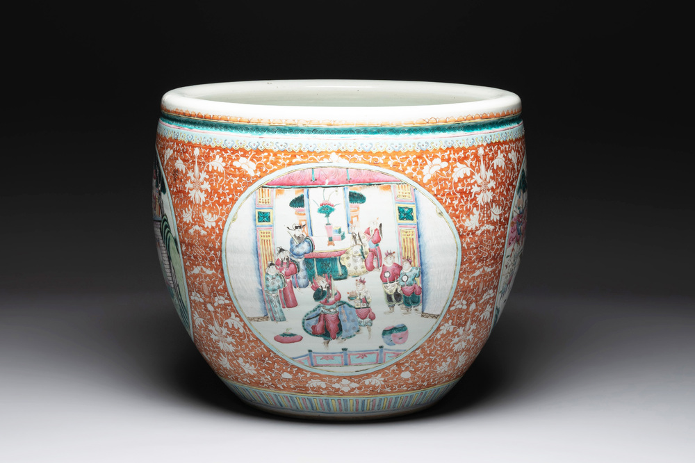 A large Chinese famille rose coral-red-ground fish bowl with narrative design, 19th C.