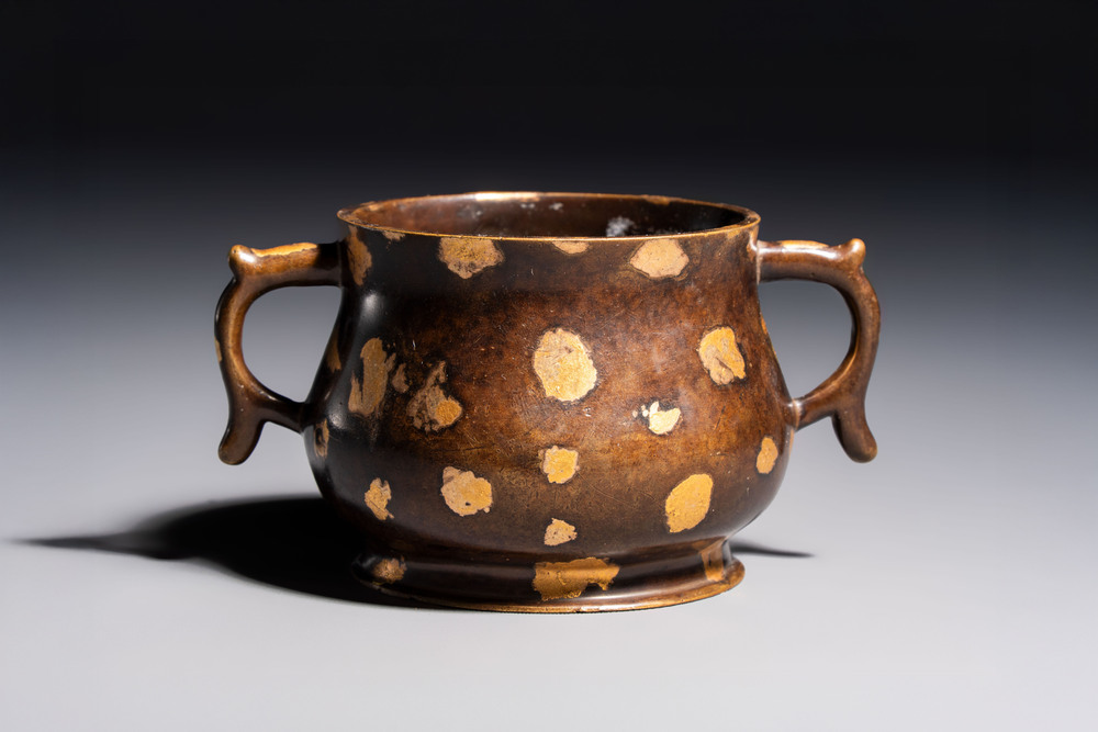 A Chinese gold-splashed bronze censer with two handles, Xuande mark, 18th C.