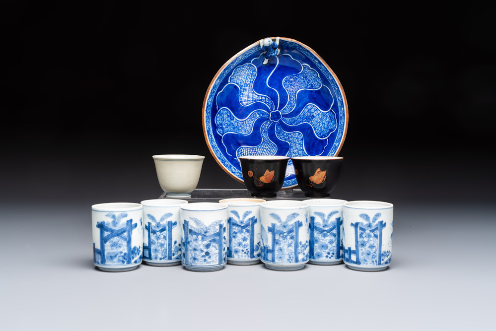 A Japanese blue and white plate, eight cups, and two gilt-lacquered porcelain cups, 19/20th C.