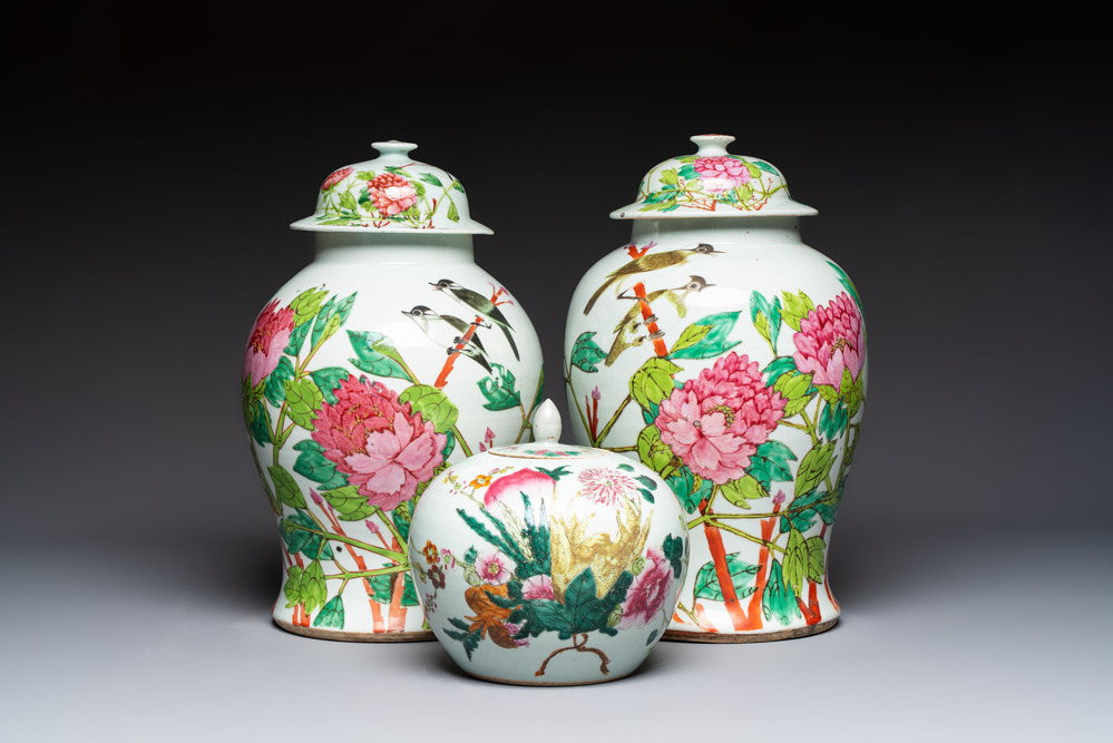 Two Chinese famille rose 'Birds among Flowering Branches' covered vases and a covered jar, 19/20th C.