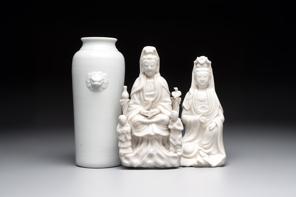 Two Chinese Dehua blanc de Chine groups of Guanyin and a vase with lion-head handles, 18th C. and later