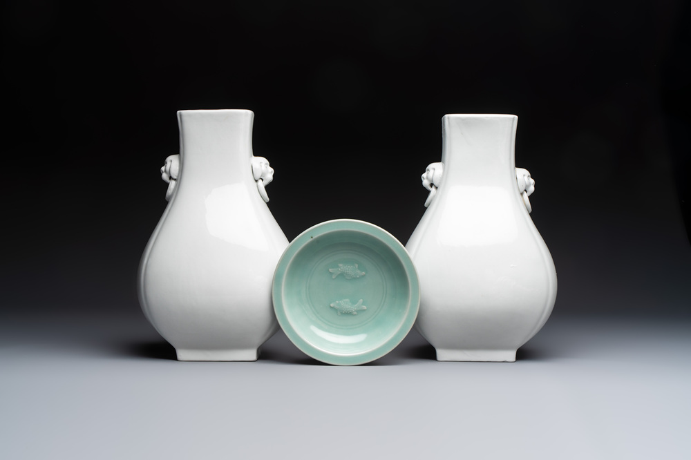 A pair of Chinese white-glazed 'Hu' vases and a Longquan celadon 'Twin Fish' plate, 20th C.