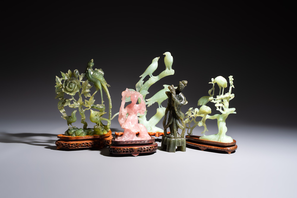 Five Chinese hardstone carvings, four with wooden stands, 20th C.