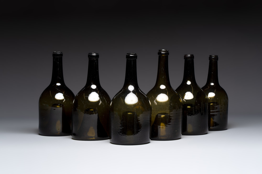 A set of six dark green glass mallet-shaped bottles, possibly France or England, 19th C. or earlier