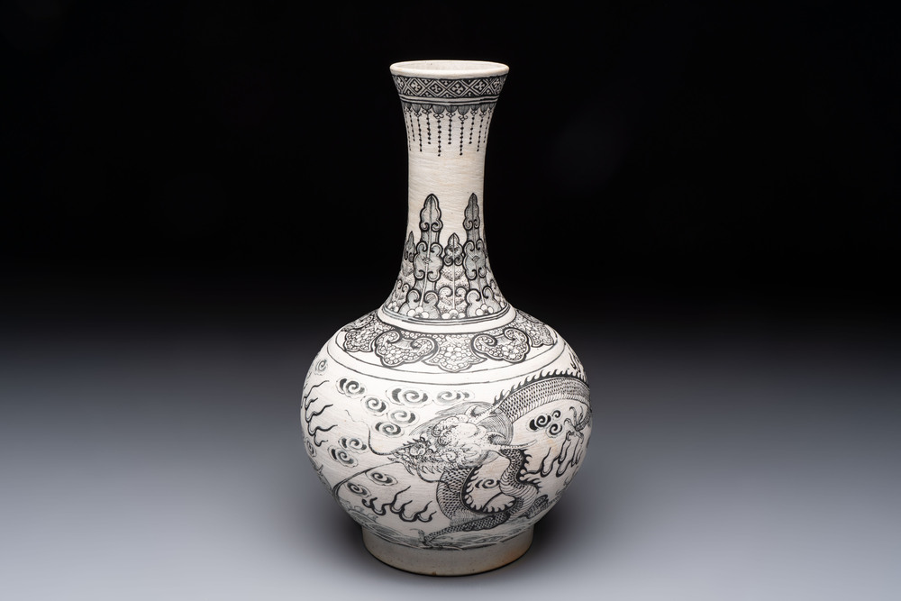 A Chinese black-enamelled biscuit 'Dragon' vase, Kangxi mark, 19th C.