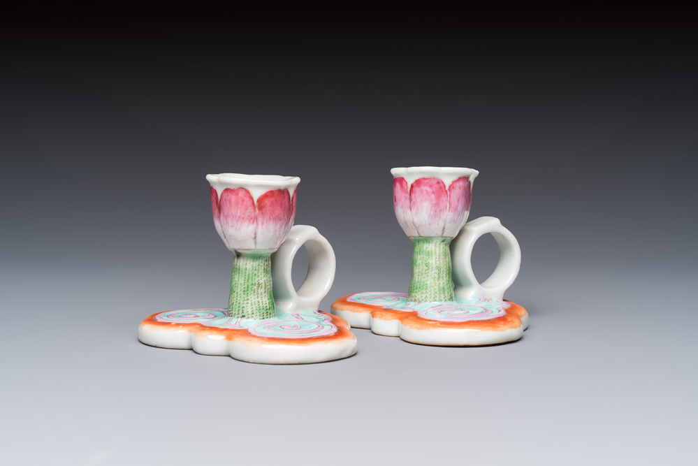 A pair of Chinese export famille rose lotus-form chambersticks on ruyi-shaped bases, Qianlong