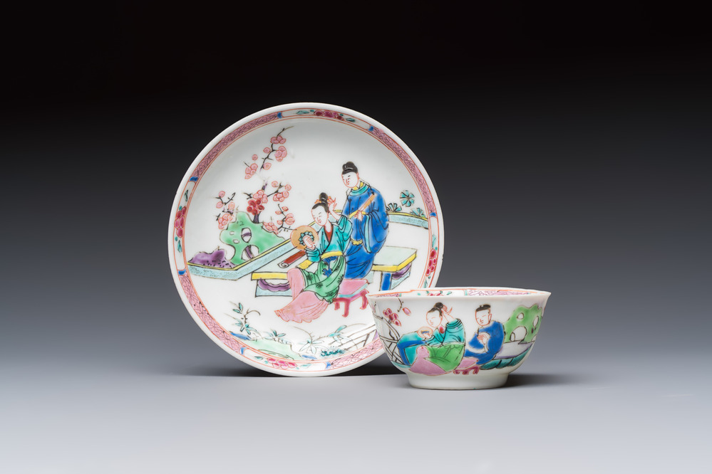 A fine Chinese famille rose cup and saucer with a couple on a terrace, Yongzheng/Qianlong