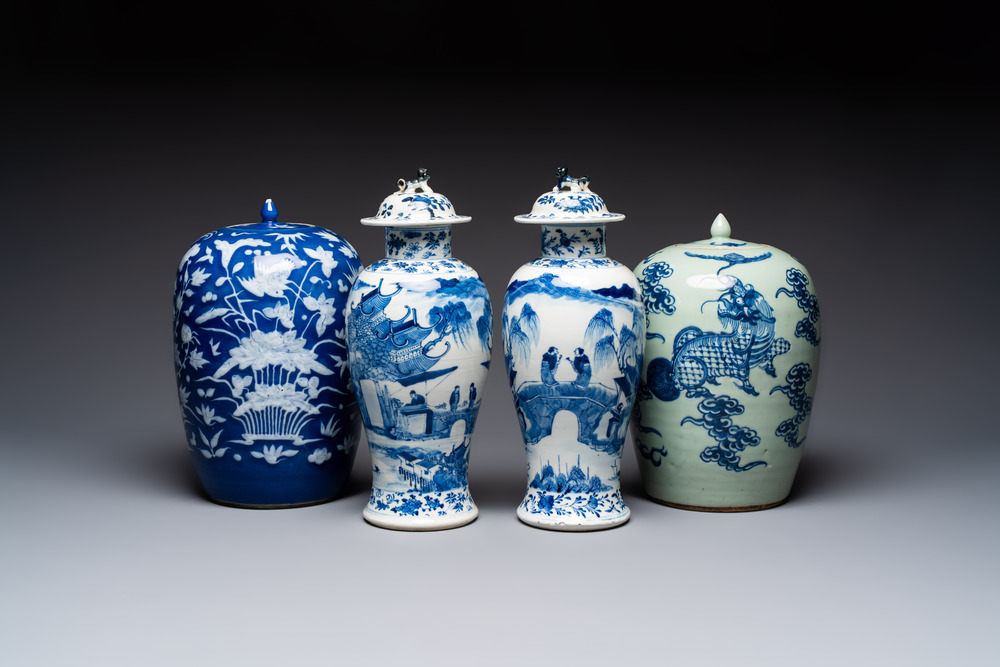 A pair of Chinese blue and white covered vases and two covered jars, Kangxi mark, 19th C