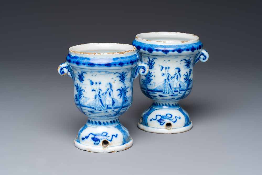 A pair of small blue and white Dutch Delft urn-shaped hyacinth vases, 18th C.