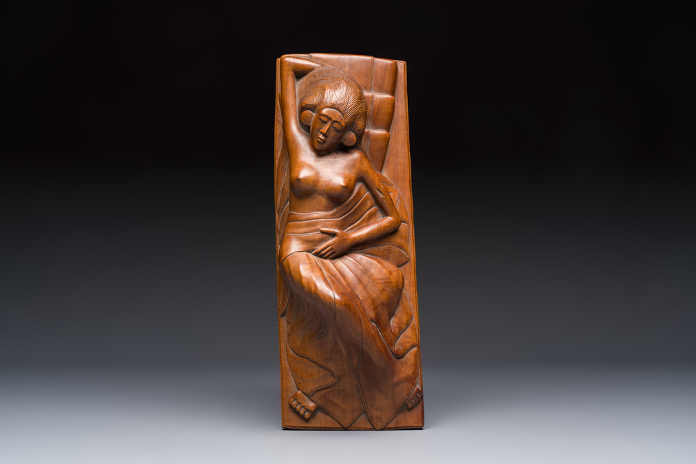A Balinese carved wooden sculpture of a reclining lady, first half 20th C.