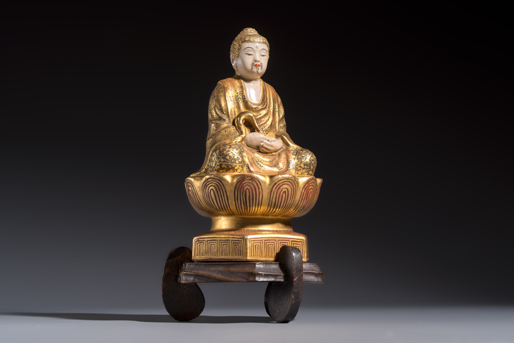 A Japanese Satsuma figure of Buddha seated on a lotus base, Hododa 保土田 mark, Meiji, 19/20th C.